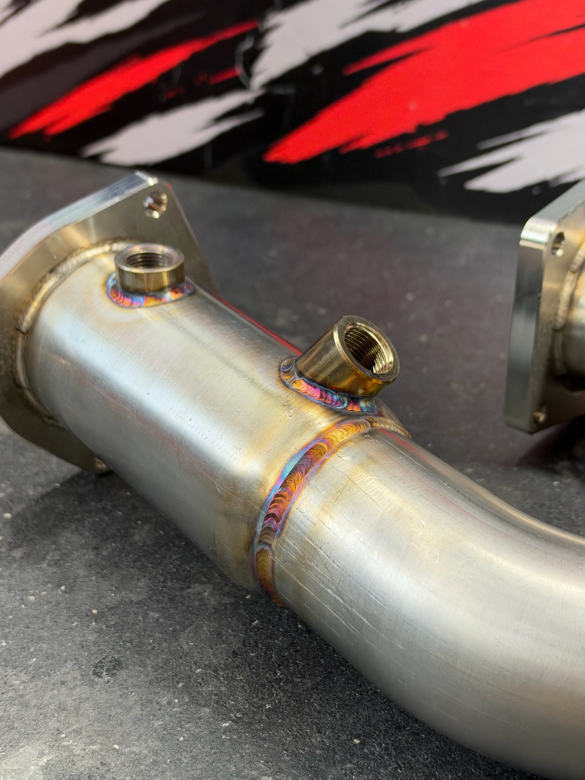 Tomlin Performance 991 Turbo downpipe, close-up of TIG welds and sensor bung