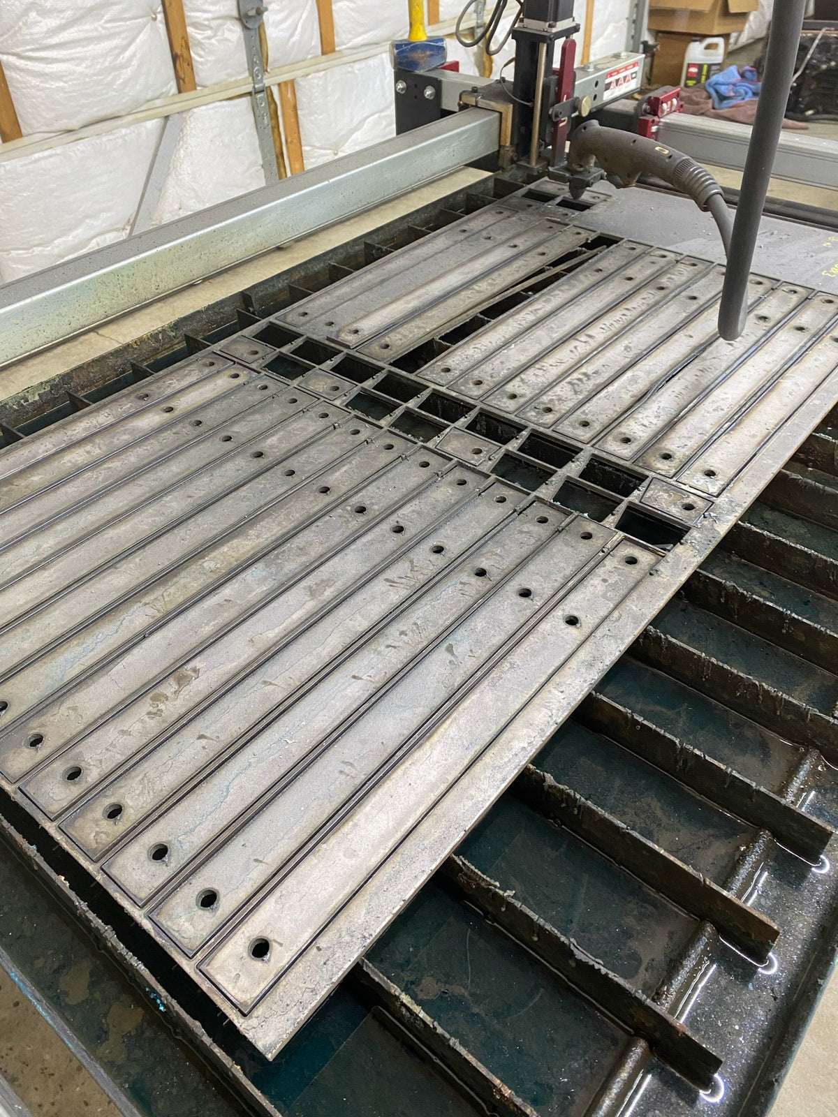 CNC-cut parts on a cutting table