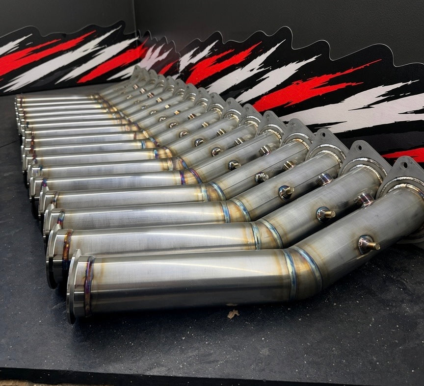 Row of TIG-welded downpipes in the Tomlin Performance shop